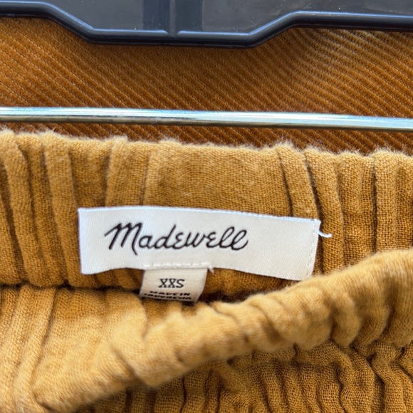 Madewell Double Gauze Smocked Mini Skirt in Mustard. - Picture 2 of 5